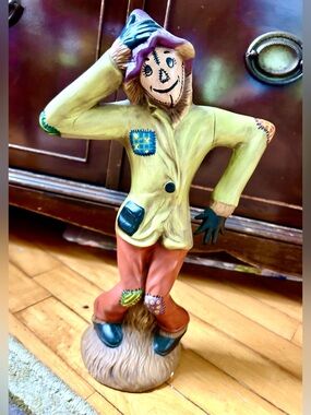 Whimsical Scarecrow Figurine in Yellow Jacket & Rust Pants with Purple Hat.